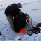 Woman and Dog Saved from Freezing Water