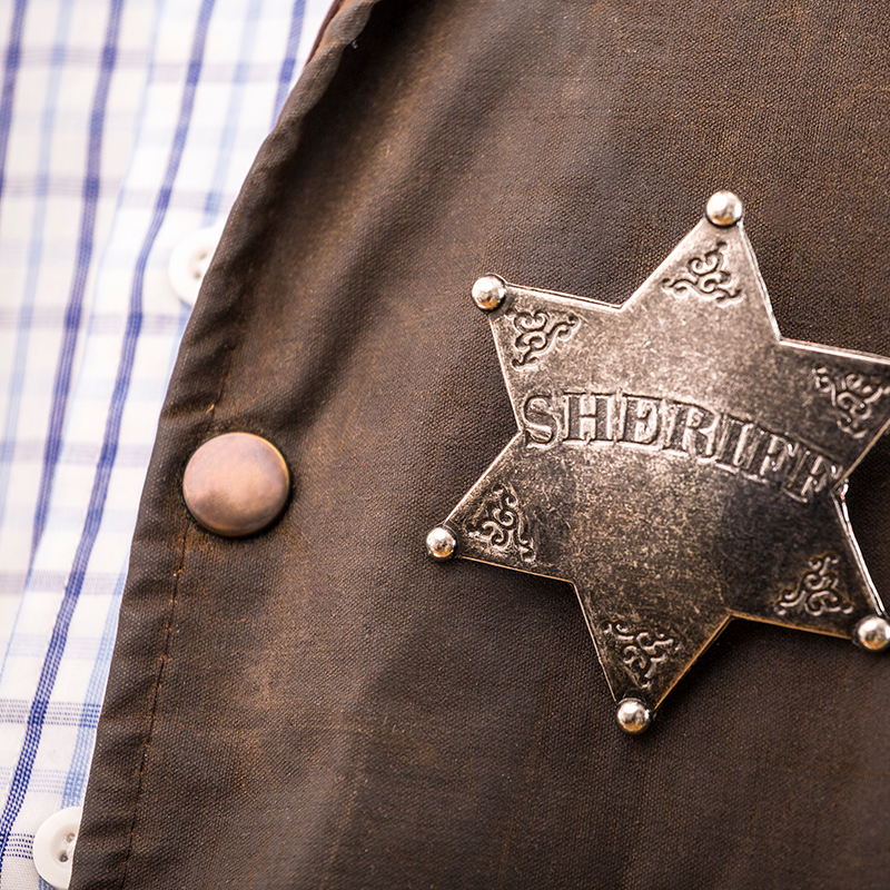 cropped image of police officer walking away